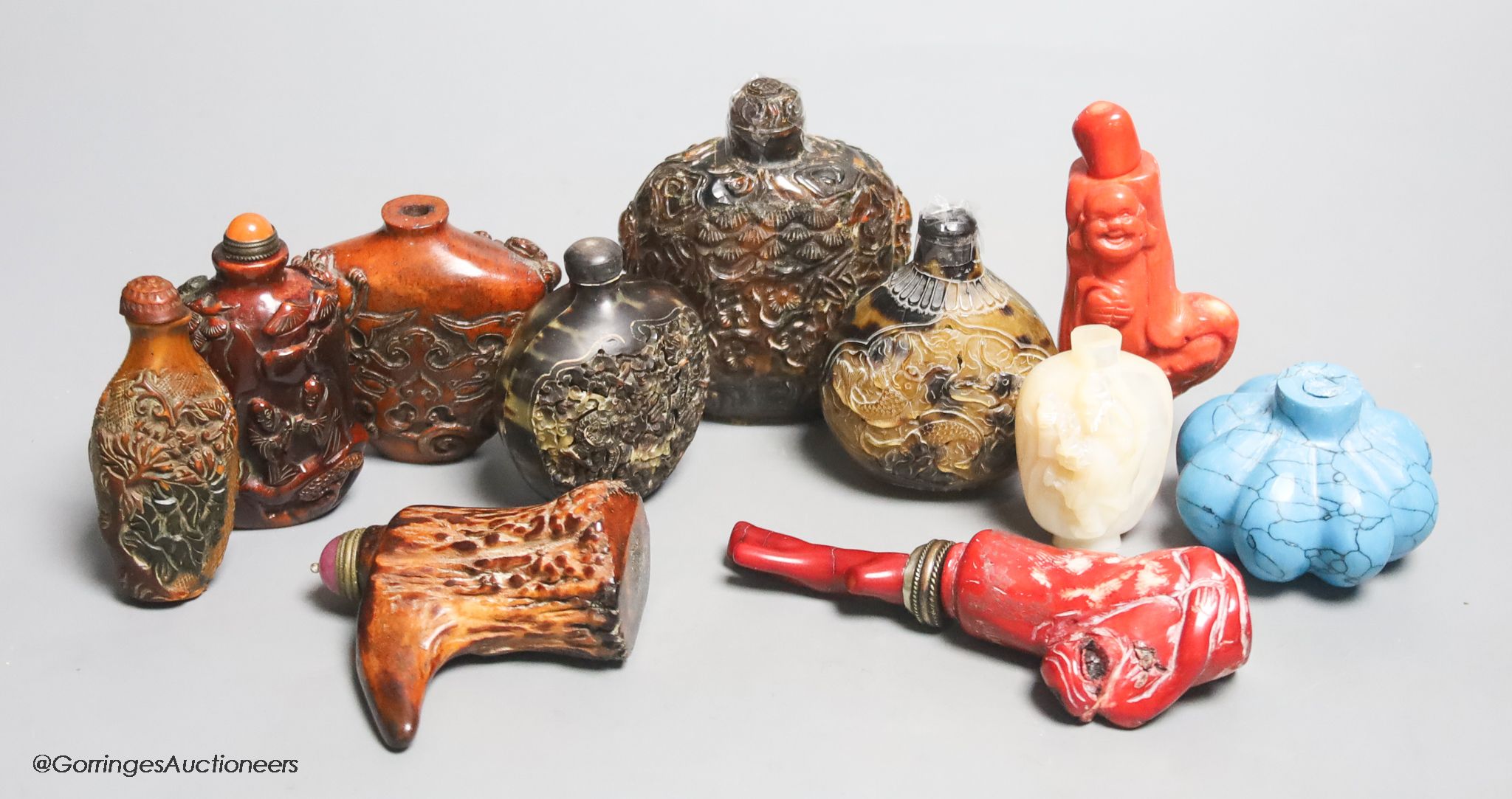 A collection of Chinese eleven horn and mother of pearl snuff bottles